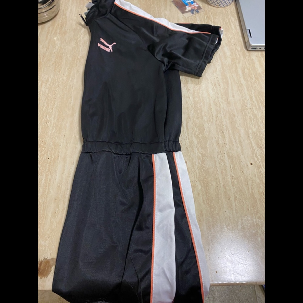 A pink black and white puma dress